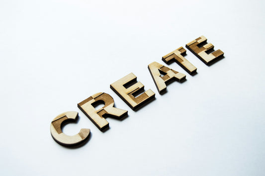 Wooden letters and shapes on a wooden surface